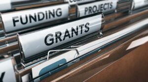 Community Fund; Grants, Funding and Projects tabs in a paper filing system