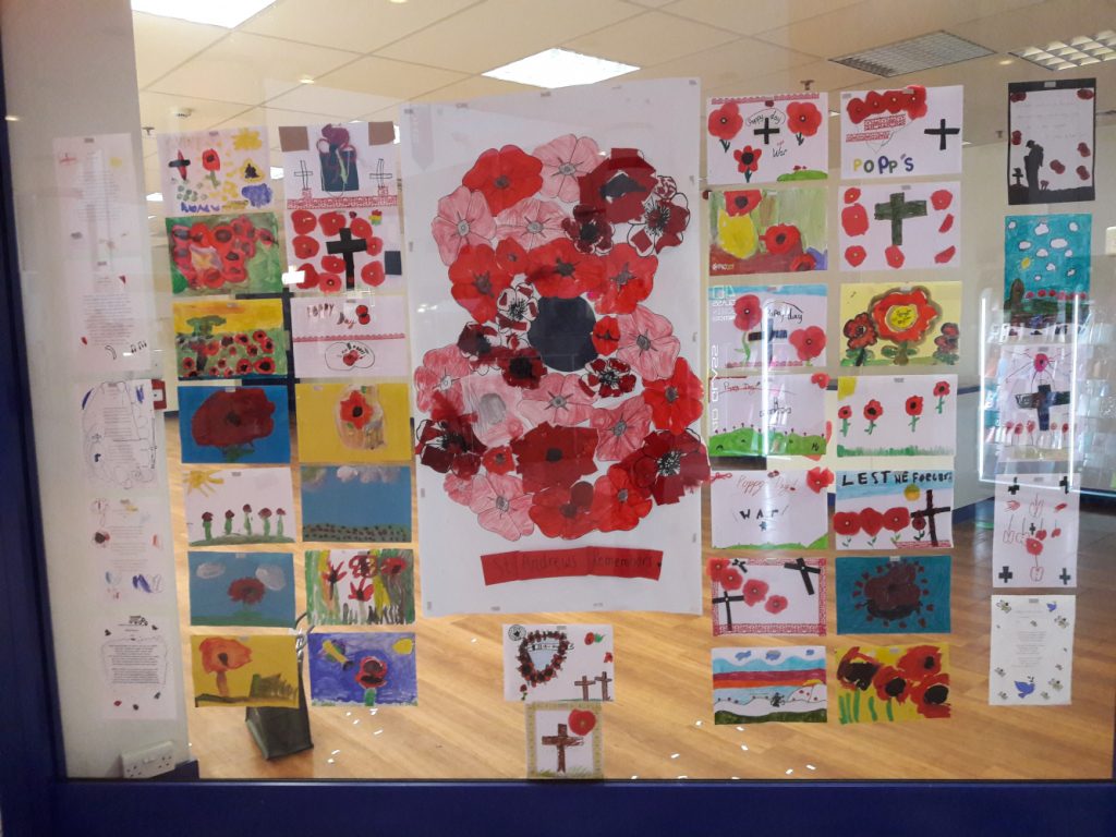 Remembrance artwork from children of St Andrews School, displayed in a Shop Window