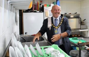 Councillor Dave Fleming washing up