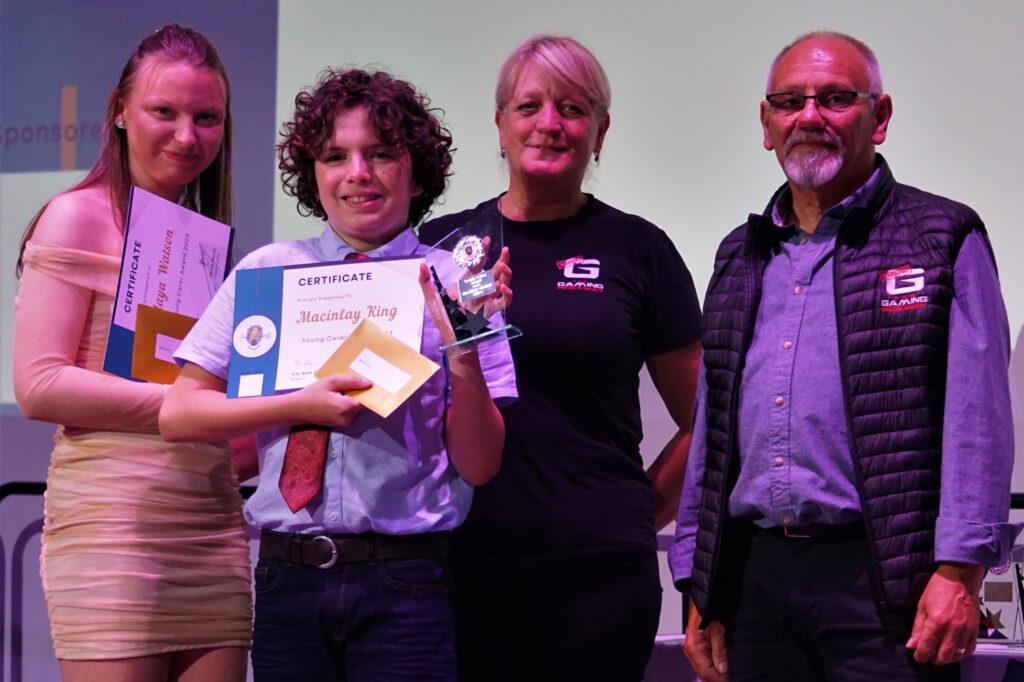 Winners of the Young Carer Award 2023 - Maya Watson and Macinlay King with Elaine and Keith Gordon from the Gaming Hideaway